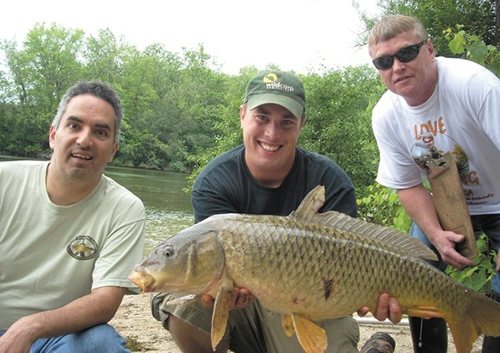 James Daher, from Mickey’s Bait & Tackle, Jason Bernhardt, Wild Carp Co. and weigh marshal, David France, show off a catch at one of the tournament pegs at the carp tournament hosted Saturday during the Free Fishing Weekend on Onondaga Lake. James Daher, from Mickey’s Bait & Tackle, Jason Bernhardt, Wild Carp Co. and weigh marshal, David France, show off a catch at one of the tournament pegs at the carp tournament hosted Saturday during the Free Fishing Weekend on Onondaga Lake.